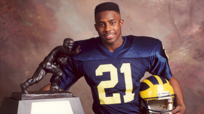Desmond-With-Heisman-Michigan